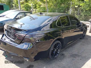 2022 Toyota Camry TRD with VIN 4T1KZ1AK2NU064511, listed as a IAAI auction lot 42176608 with 28,064 mi miles and . Bid and sale history available at DreamBid. Image 4.