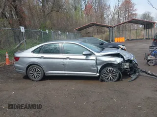 2021 Volkswagen Jetta S z VIN 3VWC57BUXMM048600, wystawiony jako IAAI lot #41956222 z przebiegiem 59 870 mil mil oraz . Historia ofert i sprzedaży dostępna na DreamBid. Obrazek 13.