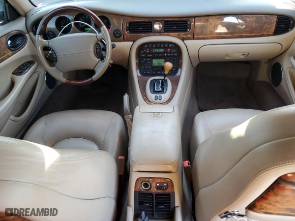 2001 Jaguar XJ VDP with VIN SAJDA24C11LF28715, listed as a Copart auction lot 65246334 with 107,965 mi miles and Salvage Title. Bid and sale history available at carsss.com. Image 8.