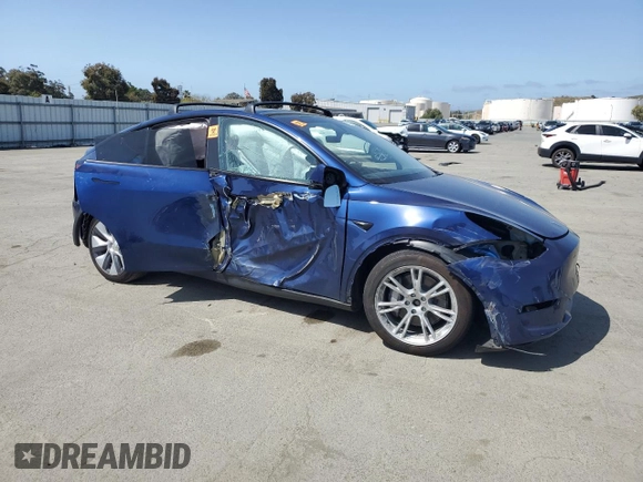 2023 Tesla Model Y Long Range with VIN 7SAYGAEE8PF927092, listed as a Copart auction lot 53917185 with 17,639 mi miles and Salvage Title. Bid and sale history available at DreamBid. Image 4.