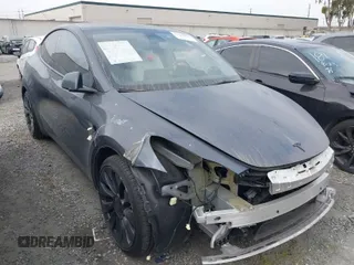 2023 Tesla Model Y Performance z VIN 7SAYGDEF6PF774965, wystawiony jako IAAI lot #41655550 z przebiegiem 33 824 mil mil oraz . Historia ofert i sprzedaży dostępna na DreamBid. Obrazek 1.