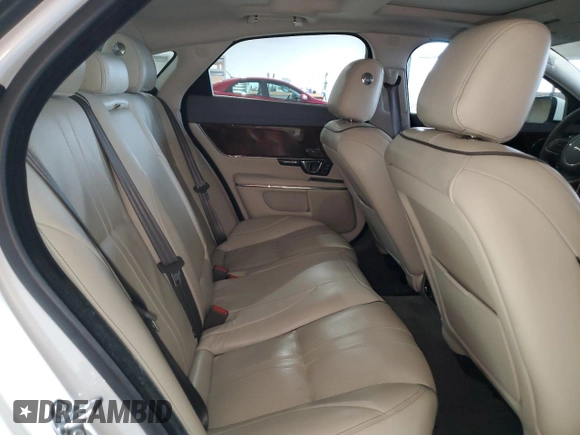 2016 Jaguar XJ R-Sport with VIN SAJWJ1CDXG8W00145, listed as a Copart auction lot 49901234 with 76,629 mi miles and . Bid and sale history available at DreamBid. Image 10.