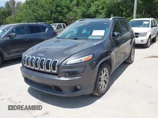 2016 Jeep Cherokee Latitude with VIN 1C4PJLCBXGW265431, listed as a IAAI auction lot 42542328 with 127,249 mi miles and . Bid and sale history available at DreamBid. Image 2.