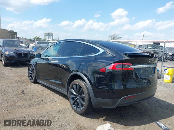 2019 Tesla Model X 75D with VIN 5YJXCBE21KF180203, listed as a IAAI auction lot 42190255 with 114,294 mi miles and . Bid and sale history available at DreamBid. Image 3.