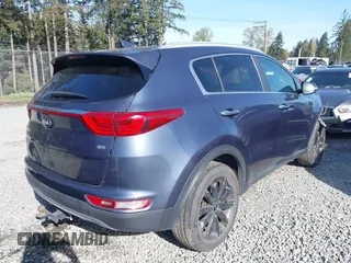 2019 Kia Sportage EX with VIN KNDPNCAC7K7615908, listed as a IAAI auction lot 42004220 with 86,654 mi miles. Bid and sale history available at carsss.com. Image 4.