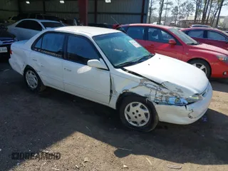 1999 Toyota Corolla VE z VIN 2T1BR12E6XC211622, wystawiony jako IAAI lot #41774641 z przebiegiem 195 950 mil mil oraz . Historia ofert i sprzedaży dostępna na DreamBid. Obrazek 1.