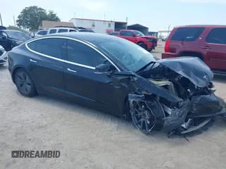 2020 Tesla Model 3 Standard Range Plus z VIN 5YJ3E1EA9LF738102, wystawiony jako IAAI lot #42107744 z przebiegiem 73 294 mil mil oraz . Historia ofert i sprzedaży dostępna na DreamBid. Obrazek 1.