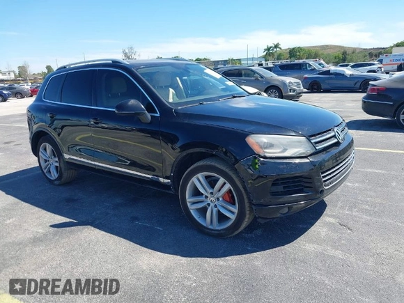 2013 Volkswagen Touareg Lux with VIN WVGEF9BP6DD004454, listed as a IAAI auction lot 41862958 with 239,548 mi miles and . Bid and sale history available at DreamBid. Image 1.