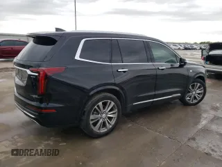 2023 Cadillac XT6 FWD Premium Luxury z VIN 1GYKPCRS5PZ101867, wystawiony jako Copart lot #51773545 z przebiegiem 31 322 mil mil oraz Szkoda całkowita • Salvage title. Historia ofert i sprzedaży dostępna na DreamBid. Obrazek 3.