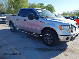2011 Ford F-150 XLT with VIN 1FTFW1ETXBFB77415, listed as a IAAI auction lot 42048378 with 202,620 mi miles. Bid and sale history available at carsss.com. Image 1.