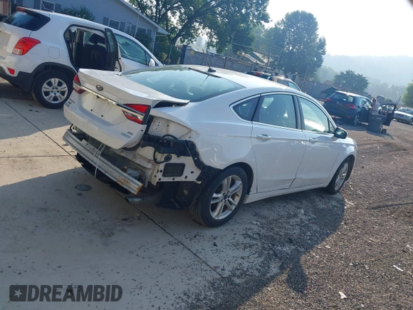 2018 Ford Fusion SE with VIN 3FA6P0HDXJR135927, listed as a IAAI auction lot 42645427 with 107,756 mi miles and . Bid and sale history available at DreamBid. Image 4.