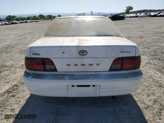 1996 Toyota Camry DX with VIN JT2BG12K7T0351784, listed as a Copart auction lot 52815345 with 303,537 mi miles and Clean Title. Bid and sale history available at carsss.com. Image 6.