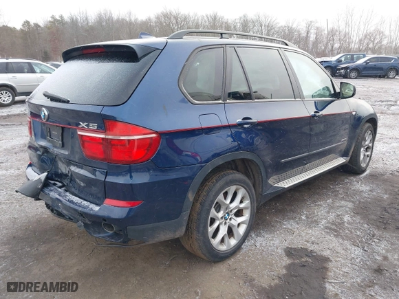 2011 BMW X5 35i with VIN 5UXZV4C54BL738262, listed as a IAAI auction lot 41633474 with 173,914 mi miles. Bid and sale history available at carsss.com. Image 4.