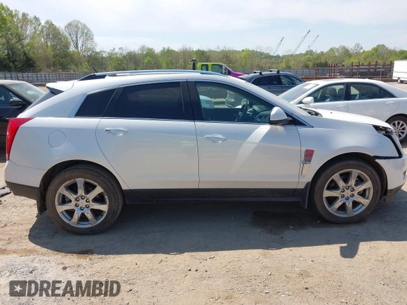 2012 Cadillac SRX Performance Collection z VIN 3GYFNBE39CS628740, wystawiony jako IAAI lot #42063414 z przebiegiem 88 260 mil mil oraz . Historia ofert i sprzedaży dostępna na DreamBid. Obrazek 13.