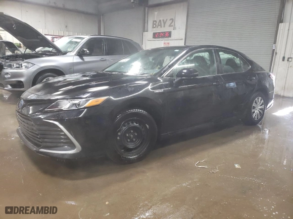 2021 Toyota Camry Hybrid LE with VIN 4T1C31AK3MU021767, listed as a Copart auction lot 89345345 with 51,755 mi miles and Salvage Title. Bid and sale history available at carsss.com. Image 1.
