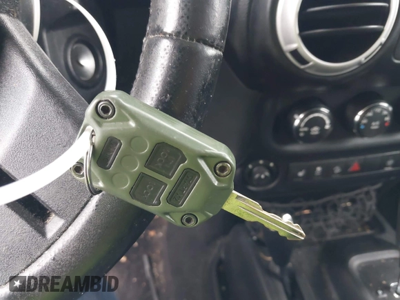 2014 Jeep Wrangler Unlimited Rubicon with VIN 1C4HJWFG4EL104827, listed as a IAAI auction lot 42236622 with 90,935 mi miles and . Bid and sale history available at DreamBid. Image 11.