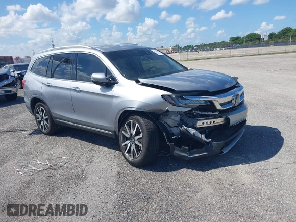 2021 Honda Pilot Touring 8-Passenger with VIN 5FNYF5H99MB041638, listed as a IAAI auction lot 42112915 with 33,230 mi miles and . Bid and sale history available at DreamBid. Image 1.
