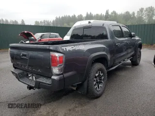 2020 Toyota Tacoma SR5 with VIN 3TMDZ5BN2LM097782, listed as a Copart auction lot 61573465 with 57,321 mi miles and Salvage title. Bid and sale history available at DreamBid. Image 3.