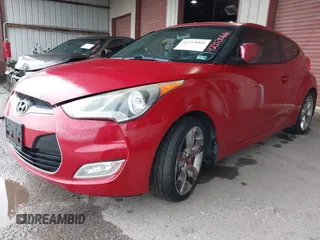 2014 Hyundai Veloster z VIN KMHTC6AD3EU201508, wystawiony jako IAAI lot #42353066 z przebiegiem 140 032 mil mil oraz . Historia ofert i sprzedaży dostępna na DreamBid. Obrazek 2.
