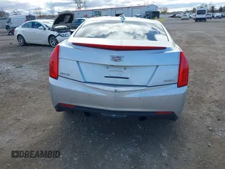 2015 Cadillac ATS Luxury RWD z VIN 1G6AB5RXXF0123831, wystawiony jako IAAI lot #40754245 z przebiegiem Nie podano mil oraz . Historia ofert i sprzedaży dostępna na DreamBid. Obrazek 16.