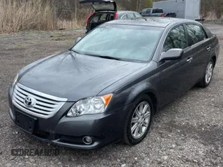 2010 Toyota Avalon XL with VIN 4T1BK3DB5AU353288, listed as a Copart auction lot 56857935 with 233,775 mi miles and Clean Title. Bid and sale history available at DreamBid. Image 2.