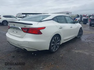 2016 Nissan Maxima SV z VIN 1N4AA6AP2GC401273, wystawiony jako IAAI lot #41898456 z przebiegiem 139 720 mil mil oraz . Historia ofert i sprzedaży dostępna na DreamBid. Obrazek 4.