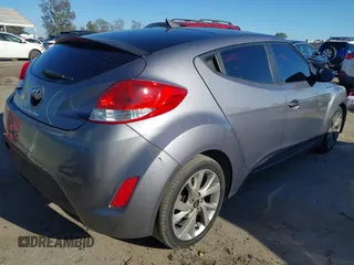 2016 Hyundai Veloster with VIN KMHTC6AD3GU283985, listed as a IAAI auction lot 41872103 with 153,949 mi miles. Bid and sale history available at carsss.com. Image 4.