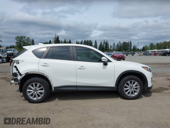 2015 Mazda CX-5 Touring with VIN JM3KE4CY4F0488484, listed as a IAAI auction lot 42115093 with 156,344 mi miles. Bid and sale history available at carsss.com. Image 14.