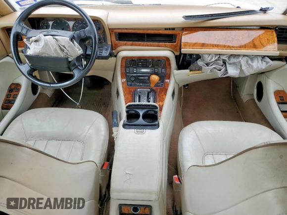 1994 Jaguar XJ with VIN SAJKX1743RC698636, listed as a Copart auction lot 56376685 with 192,928 mi miles and Salvage title. Bid and sale history available at DreamBid. Image 8.