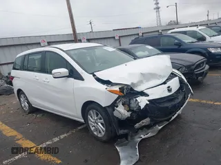 2014 Mazda 5 Sport z VIN JM1CW2BL6E0164259, wystawiony jako IAAI lot #41866123 z przebiegiem Nie podano mil oraz . Historia ofert i sprzedaży dostępna na DreamBid. Obrazek 1.