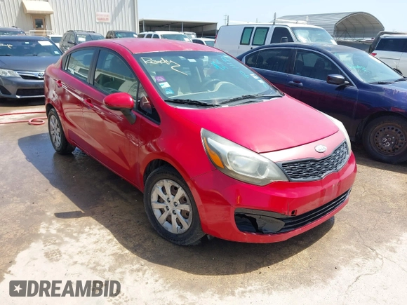 2012 Kia Rio LX with VIN KNADM4A36C6085057, listed as a IAAI auction lot 42111921 with 136,217 mi miles. Bid and sale history available at carsss.com. Image 1.