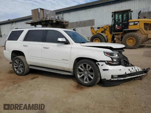 2015 Chevrolet Tahoe LTZ with VIN 1GNSKCKC1FR310018, listed as a Copart auction lot 71798454 with 244,179 mi miles and Salvage title. Bid and sale history available at DreamBid. Image 4.