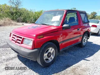 1998 Chevrolet Tracker z VIN 2CNBE1866W6924835, wystawiony jako IAAI lot #41821459 z przebiegiem 54 512 mil mil oraz . Historia ofert i sprzedaży dostępna na DreamBid. Obrazek 2.