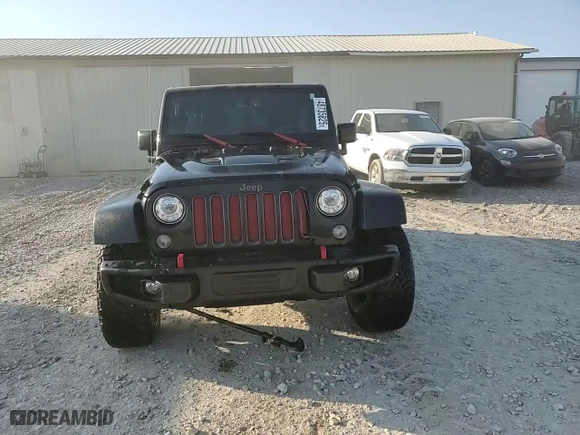 2017 Jeep Wrangler Unlimited Rubicon with VIN 1C4HJWFG2HL704847, listed as a Copart auction lot 48735825 with 100,953 mi miles and Salvage Title. Bid and sale history available at carsss.com. Image 14.