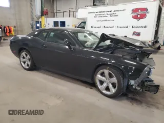 2013 Dodge Challenger R/T z VIN 2C3CDYBT9DH501059, wystawiony jako Copart lot #55139865 z przebiegiem 95 112 mil mil oraz Szkoda całkowita • Salvage title. Historia ofert i sprzedaży dostępna na DreamBid. Obrazek 4.