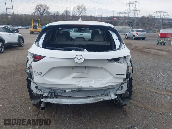 2020 Mazda CX-5 Grand Touring with VIN JM3KFBDM5L0731373, listed as a IAAI auction lot 41900567 with 31,268 mi miles and . Bid and sale history available at DreamBid. Image 16.