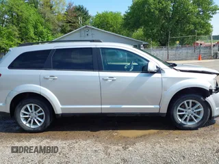 2013 Dodge Journey SXT z VIN 3C4PDCBG4DT564290, wystawiony jako IAAI lot #42225485 z przebiegiem 69 029 mil mil oraz . Historia ofert i sprzedaży dostępna na DreamBid. Obrazek 13.