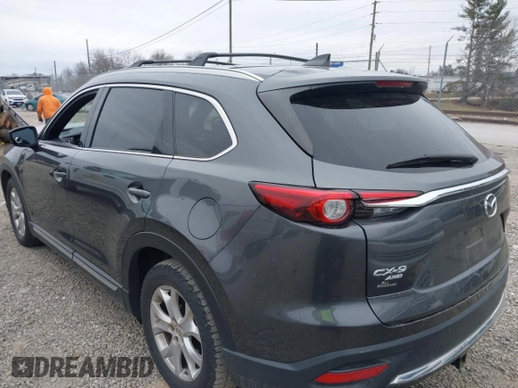 2016 Mazda CX-9 Grand Touring with VIN JM3TCBDY1G0103560, listed as a IAAI auction lot 41344813 with 123,588 mi miles and . Bid and sale history available at DreamBid. Image 3.
