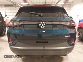 2023 Volkswagen ID.4 Pro z VIN 1V2DNPE84PC038042, wystawiony jako IAAI lot #41446269 z przebiegiem 12 878 mil mil oraz . Historia ofert i sprzedaży dostępna na DreamBid. Obrazek 17.