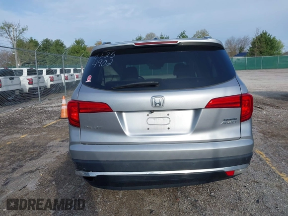 2016 Honda Pilot Touring with VIN 5FNYF6H90GB024902, listed as a IAAI auction lot 41948563 with 148,598 mi miles. Bid and sale history available at carsss.com. Image 16.