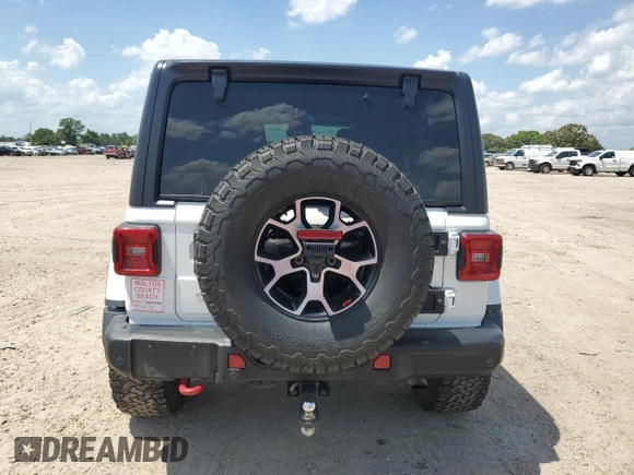 2020 Jeep Wrangler Unlimited Rubicon with VIN 1C4HJXFG3LW184249, listed as a Copart auction lot 56423665 with 63,111 mi miles and Salvage title. Bid and sale history available at DreamBid. Image 6.