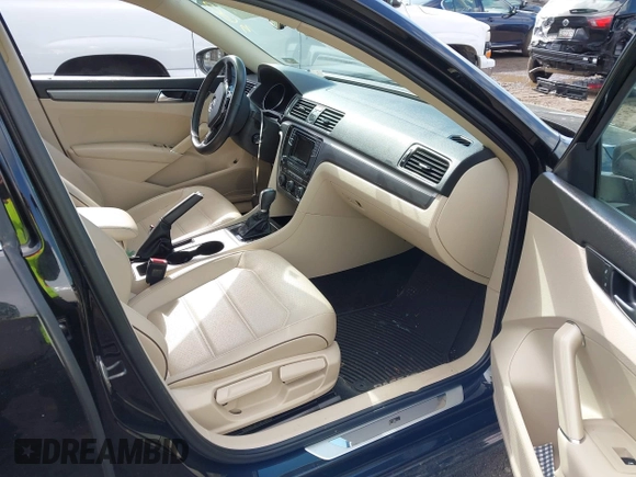 2016 Volkswagen Passat 1.8T S with VIN 1VWAT7A34GC068563, listed as a IAAI auction lot 41983202 with 60,562 mi miles. Bid and sale history available at carsss.com. Image 5.