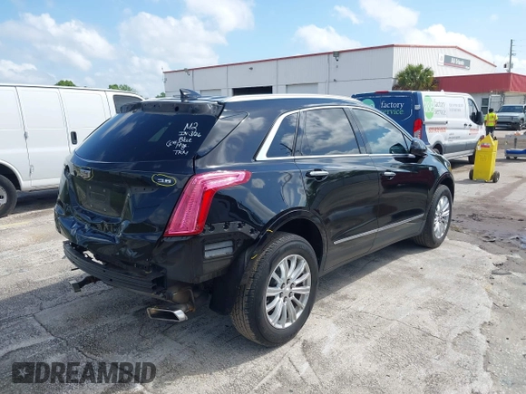 2017 Cadillac XT5 FWD with VIN 1GYKNARS6HZ123114, listed as a IAAI auction lot 41933928 with 166,213 mi miles. Bid and sale history available at carsss.com. Image 4.