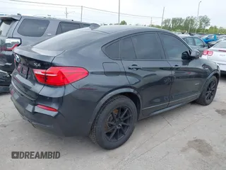 2015 BMW X4 xDrive28i with VIN 5UXXW3C54F0M88740, listed as a IAAI auction lot 42275157 with 159,281 mi miles and . Bid and sale history available at DreamBid. Image 4.