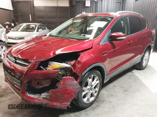 2014 Ford Escape Titanium with VIN 1FMCU9J9XEUD69589, listed as a IAAI auction lot 42031882 with 123,632 mi miles and . Bid and sale history available at DreamBid. Image 2.