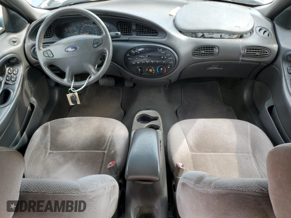 1999 Ford Taurus SE z VIN 1FAFP53U0XG322565, wystawiony jako Copart lot #54560285 z przebiegiem 164 300 mil mil oraz Szkoda całkowita • Salvage title. Historia ofert i sprzedaży dostępna na DreamBid. Obrazek 8.