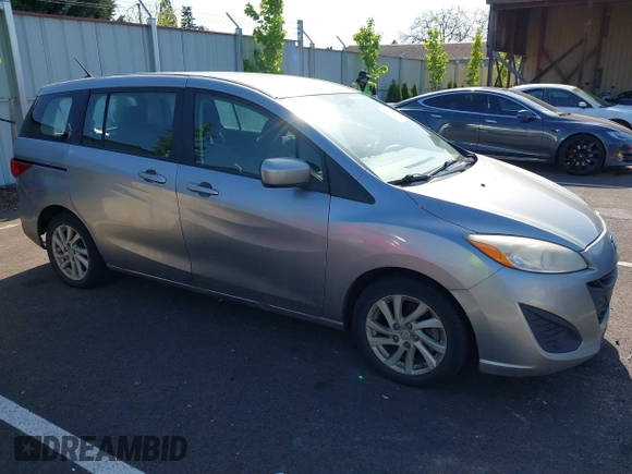 2012 Mazda 5 Sport z VIN JM1CW2BL3C0115906, wystawiony jako IAAI lot #42062899 z przebiegiem 124 286 mil mil oraz . Historia ofert i sprzedaży dostępna na DreamBid. Obrazek 1.