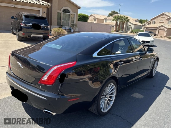 2012 Jaguar XJ with VIN SAJWA2GBXCLV24464, listed as a Copart auction lot 52572955 with 135,087 mi miles and Clean Title. Bid and sale history available at carsss.com. Image 4.