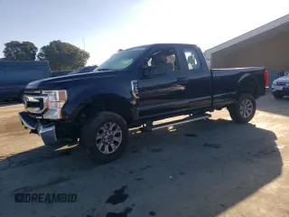 2021 Ford Super Duty F-250 SRW XL with VIN 1FT7X2BN0MEC62141, listed as a Copart auction lot 77142804 with 59,933 mi miles and Salvage Title. Bid and sale history available at carsss.com. Image 1.