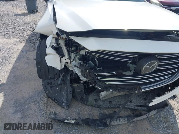 2022 Mazda CX-9 Touring with VIN JM3TCBCY4N0604912, listed as a IAAI auction lot 42456794 with 49,853 mi miles and . Bid and sale history available at DreamBid. Image 6.